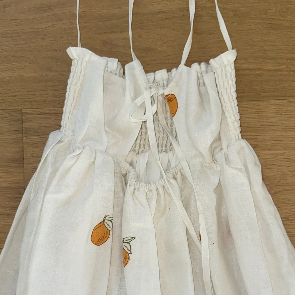White Smocked Sundress with Orange Fruit Print - Picture 3 of 7